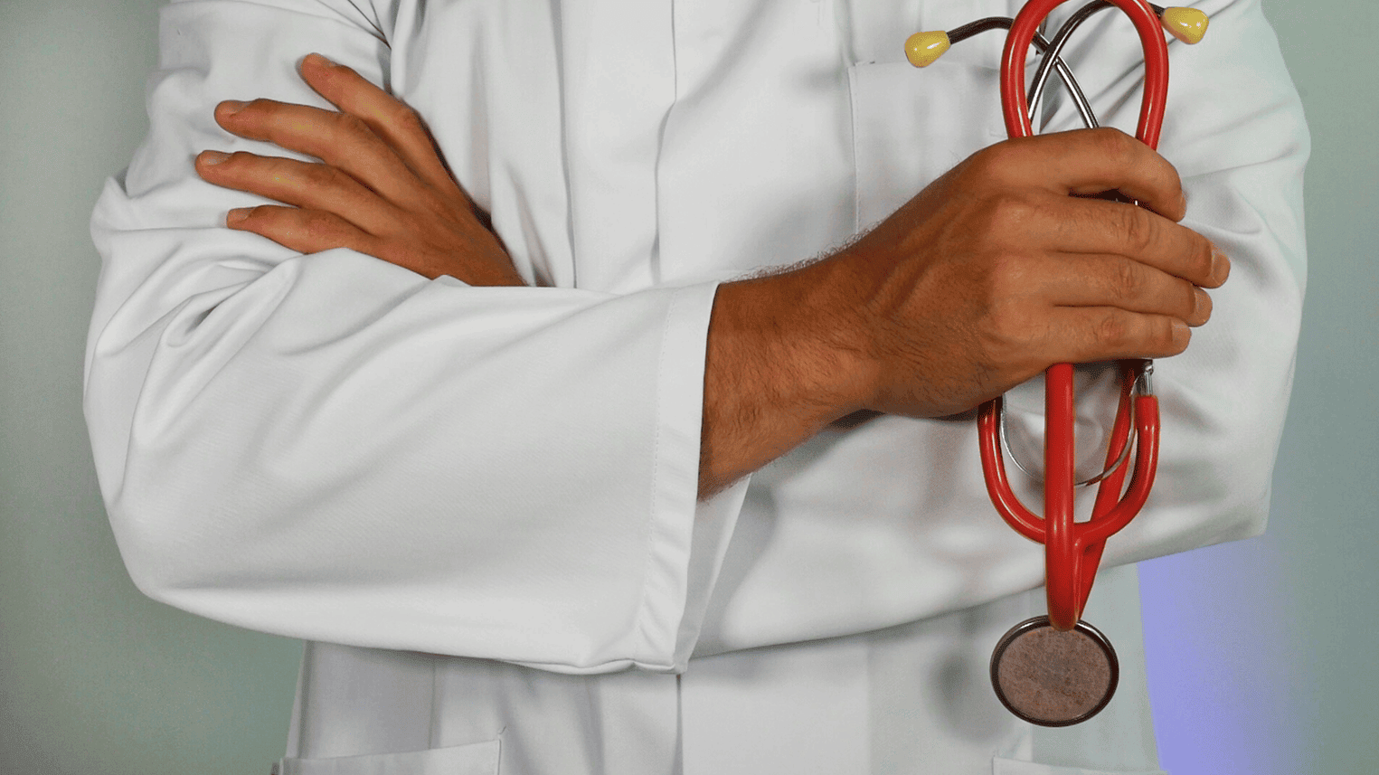 Doctor with stethoscope representing expert Care Management services for medical practices in Garden City, NY