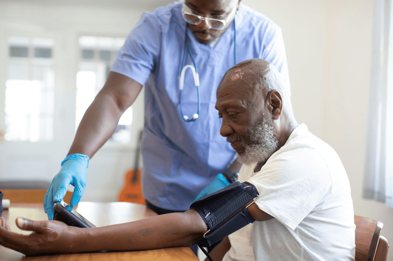 Male nurse assisting a patient as part of TCT Consultants Care Management program serving Garden City, NY