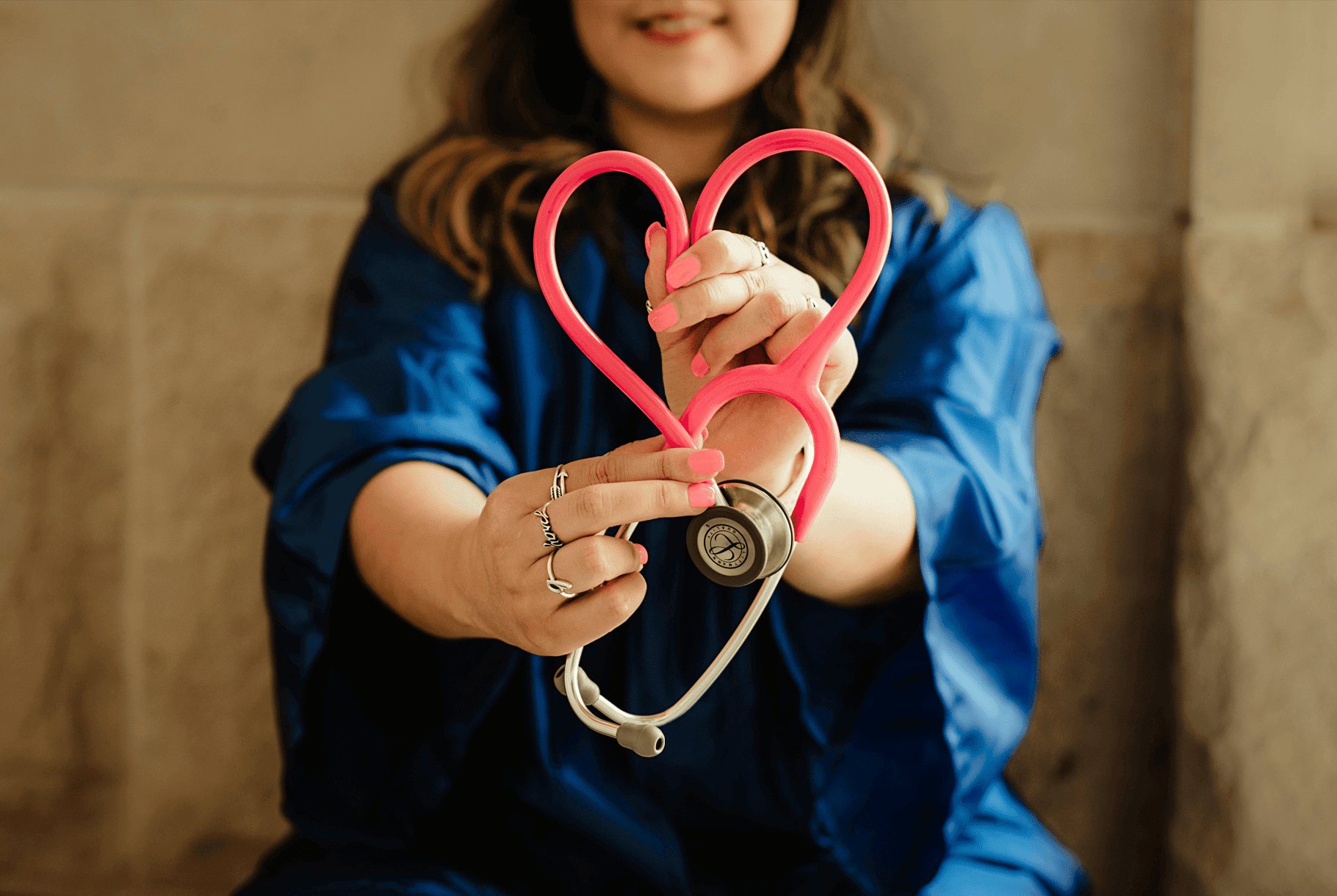 Pink stethoscope representing hands-on Care Management services for medical practices in Centereach, NY